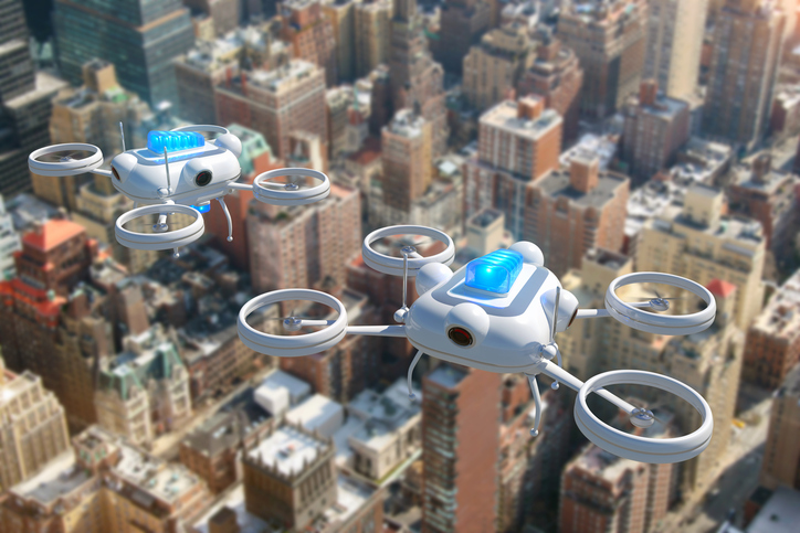 Police drones with blue emergency lights flying over New York